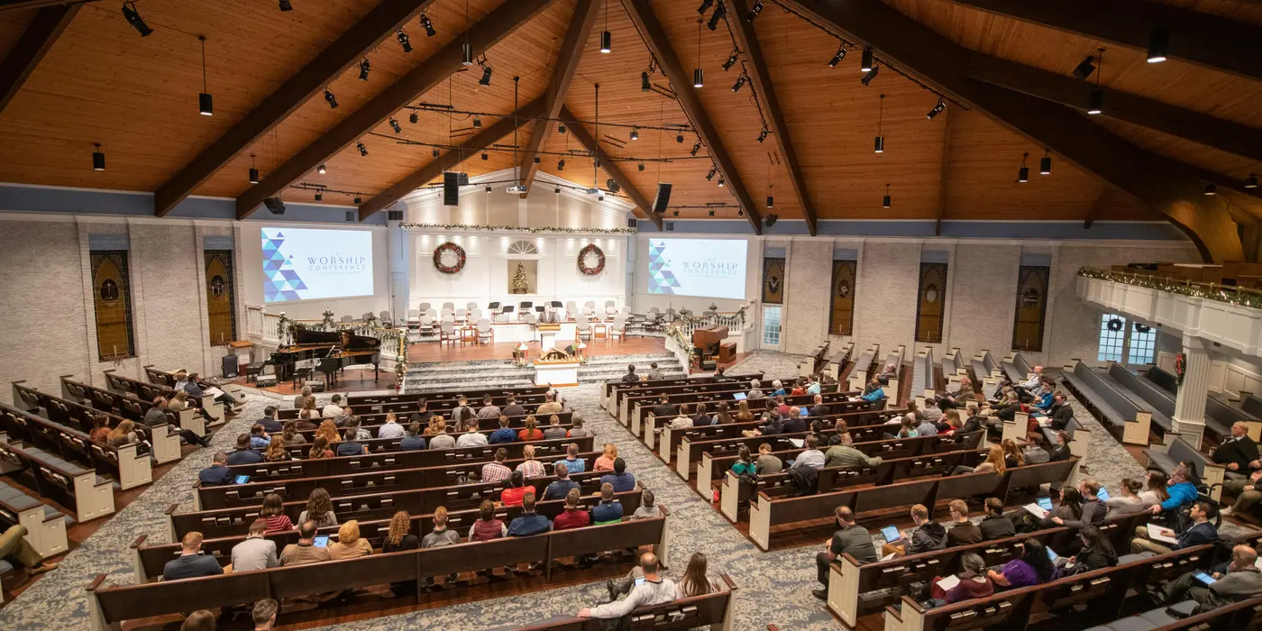 a large congregation listening to a minister sermon from CHURCH IN DALLAS in Dallas, TX - Women Bible Study Ministry