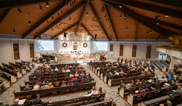 a large congregation listening to a minister sermon from CHURCH IN DALLAS in Dallas, TX - Women Bible Study Ministry