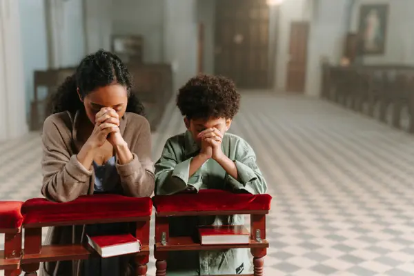 a mom and son kneeling praying from CHURCH IN DALLAS in Dallas, TX - Women Bible Study Ministry
